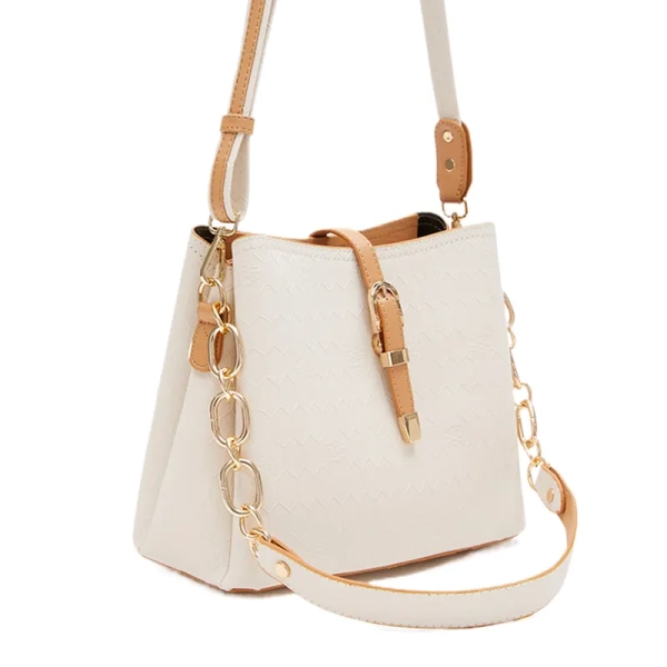 cream handbag for ladies with gold accents